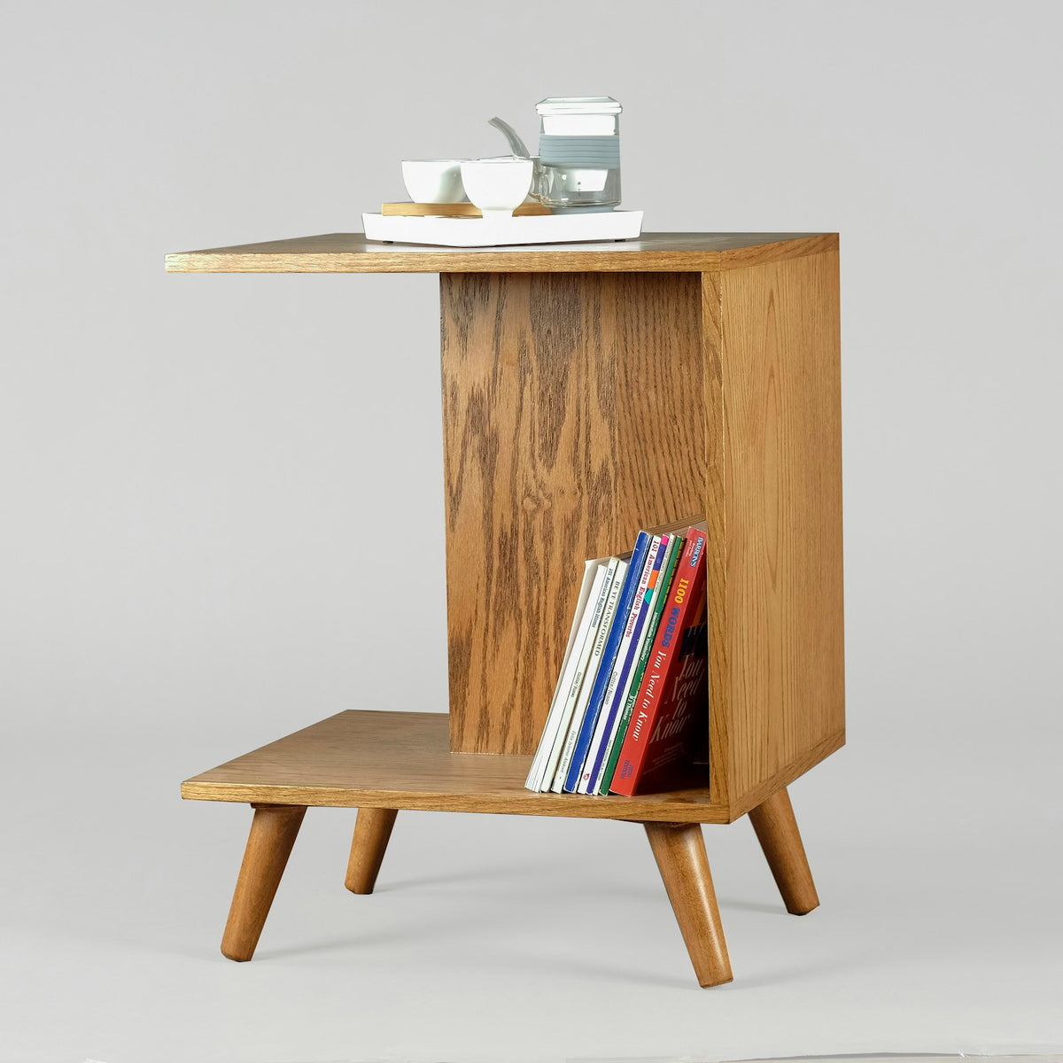 Solid wood C-shaped side table with a magazine shelf