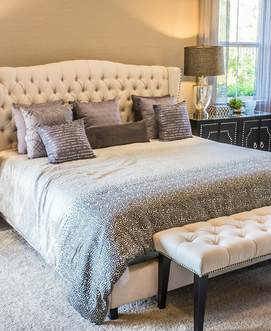 Bedroom furnished with wooden and upholstered furniture