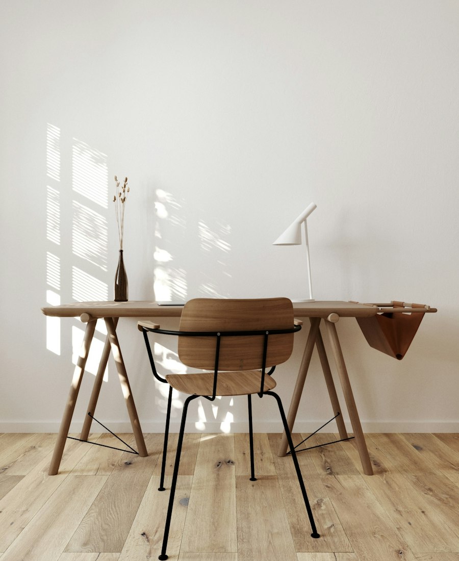 Home office furnished with wooden and upholstered furniture