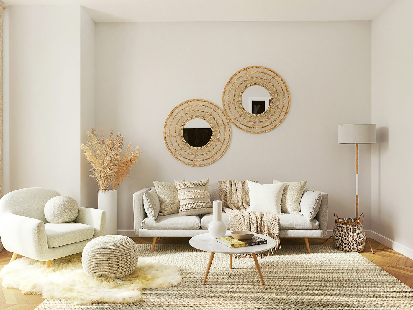 Calm living room with a cream sofa, round coffee table and woven wall mirrors
